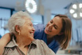 Portrait of nurse and senior patient talking in hospital corridor. Emotional support for elderly - PhotoDune Item for Sale