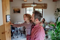 Girl helping father to adjust, lower heating temperature on thermostat. Concept of sustainable - PhotoDune Item for Sale