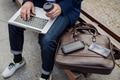 Businessman, freelancer or manager working outdoors in city park. Man with laptop on knees drinking - PhotoDune Item for Sale