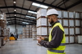 Warehouseman with tablet checking delivery, stock in warehouse. Warehouse manager using warehouse - PhotoDune Item for Sale