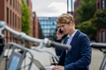 Businessman, freelancer or manager working outdoors in city park. Man with laptop on knees making - PhotoDune Item for Sale