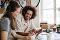Young colleagues working together in startup company. - PhotoDune Item for Sale