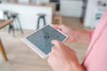 Man using smart thermostat, adjusting, lowering heating temperature at home. Concept of sustainable - PhotoDune Item for Sale