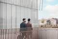 Two young elegant businessmen walking outdoors together in the streets - PhotoDune Item for Sale