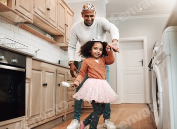Happy, portrait and girl and father dancing in the kitchen for celebration, party and bonding. Smil
