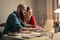 A man and a woman in front of a laptop - PhotoDune Item for Sale