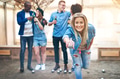 Cheerful woman playing petanque while team having beer - PhotoDune Item for Sale