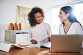 Two cheerful businesswomen at laptop with documents - PhotoDune Item for Sale