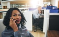 Pretty black office employee sitting and talking smartphone - PhotoDune Item for Sale