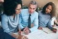People planning strategy in office and looking at camera - PhotoDune Item for Sale