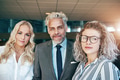 Coworking business men and women looking at camera - PhotoDune Item for Sale