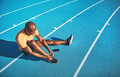 Young athlete tying his shoes before for a track run - PhotoDune Item for Sale