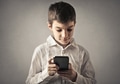 Child with a smartphone - PhotoDune Item for Sale