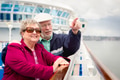 Senior Adult Couple Enjoying The View From Their Passenger Cruise Ship Railing. - PhotoDune Item for Sale