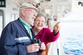 Senior Adult Couple Enjoying The View From Their Passenger Cruise Ship with Their Bonoculars. - PhotoDune Item for Sale