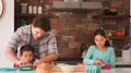 Father And Children Making Sandwiches For School Packed Lunch In Kitchen - PhotoDune Item for Sale