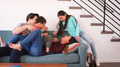 Family Shot With Parents Lying On Sofa And Playing With Children At Home - PhotoDune Item for Sale