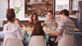 Multi Generation Family Praying Before Meal Around Table At Home - PhotoDune Item for Sale