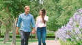 Romantic Dating Couple Walking Through Summer Park Holding Hands Together - PhotoDune Item for Sale