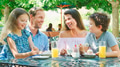 Family Sitting At Table Enjoying Snack At Outdoor Cafe Or Restaurant - PhotoDune Item for Sale