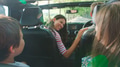 Rear View Of Family On Road Trip In Convertible Car Driving Along Tree Lined Road - PhotoDune Item for Sale