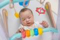 Cute baby enjoying playtime with colorful toy - PhotoDune Item for Sale