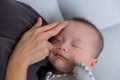 Mum caring for son skin with lotion - PhotoDune Item for Sale