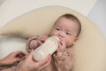 Baby drinking milk from a bottle - PhotoDune Item for Sale