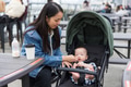 Mother taking care baby in stroller outdoor - PhotoDune Item for Sale