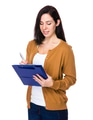 Young Woman take note on clipboard - PhotoDune Item for Sale