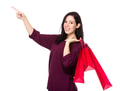 Caucasian woman hold with shopping bag and finger point up - PhotoDune Item for Sale