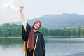 Asian Muslim women Happy congratulation university outdoors. Arab hijab girl in bachelor - PhotoDune Item for Sale