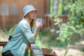 Woman Enjoying a Peaceful Morning Coffee - PhotoDune Item for Sale