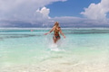 A Joyful Girl Filled with Energy Running on the Beach - PhotoDune Item for Sale