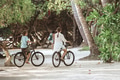 Siblings enjoying riding bicycles on the island - PhotoDune Item for Sale