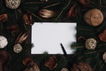 Christmas wish list with fir tree frame and natural christmas decoration on dark background. - PhotoDune Item for Sale