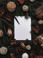 Christmas wish list with fir tree frame and natural christmas decoration on dark background. - PhotoDune Item for Sale