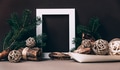 Empty photo frame on brown wall with christmas decoration. Winter holiday christmas home decor - PhotoDune Item for Sale