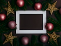Picture frame and pink christmas baubles composition on brown background. Flat lay New year - PhotoDune Item for Sale