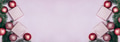 Pink christmas background top view. Shiny christmas baubles, present box and fir tree frame - PhotoDune Item for Sale