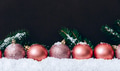 Pink christmas balls with snowflakes on dark brown wall. Elegant Christmas decoration background. - PhotoDune Item for Sale