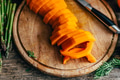 Butternut squash meal preparation on wooden kitchen table. Cooking food for thanksgiving dinner - PhotoDune Item for Sale