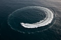Small yacht making a circle in the water - PhotoDune Item for Sale