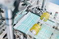 Face mask, Surgical mask production line, Closeup machine conveyor belt roller in hygiene factory - PhotoDune Item for Sale