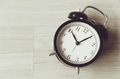 Bell clock old retro style at wooden background with copy space for text, history memory time - PhotoDune Item for Sale
