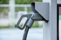 Closeup electric car charger head plug for charging EV car at ev charger station - PhotoDune Item for Sale