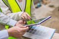 closeup construction engineer with interior design looking at tablet screen for color chart software - PhotoDune Item for Sale