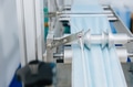 Face mask, Surgical mask production line, Closeup machine conveyor belt roller in hygiene factory - PhotoDune Item for Sale