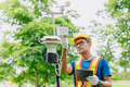 Man working collecting Air pollution, Weather monitor, Wind information data from sensor station - PhotoDune Item for Sale