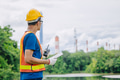 Professional engineer male with coal power plant, Power station with green nature background - PhotoDune Item for Sale